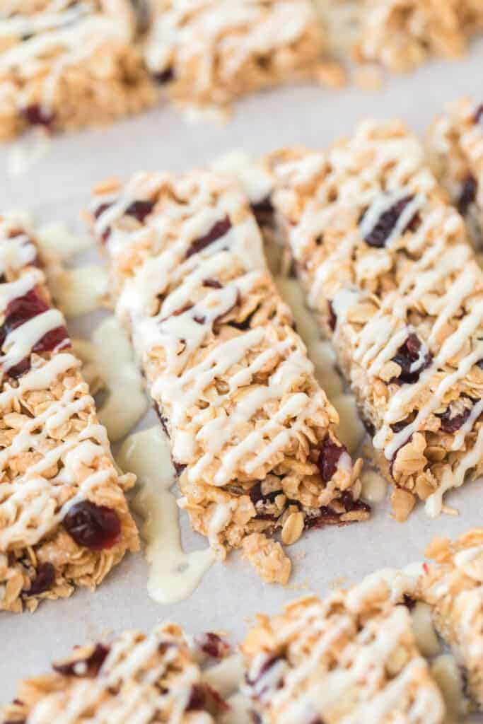rectangles of cranberry granola bars on parchment