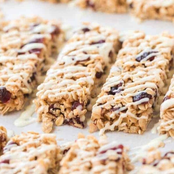 rectangles of cranberry granola bars on parchment