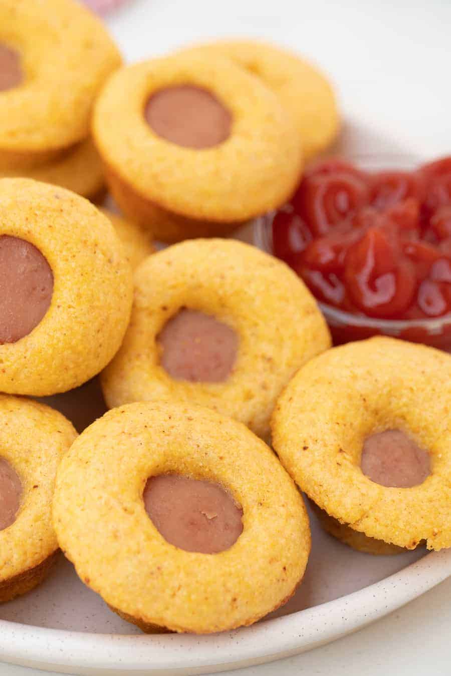 Mini baked corn dogs are a winner recipe because they're foolproof to throw together and they taste delicious for a quick and easy dinner or app! #corndogs #minicorndog #hotdog