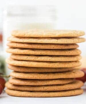 a stack of thin lightly golden cookies