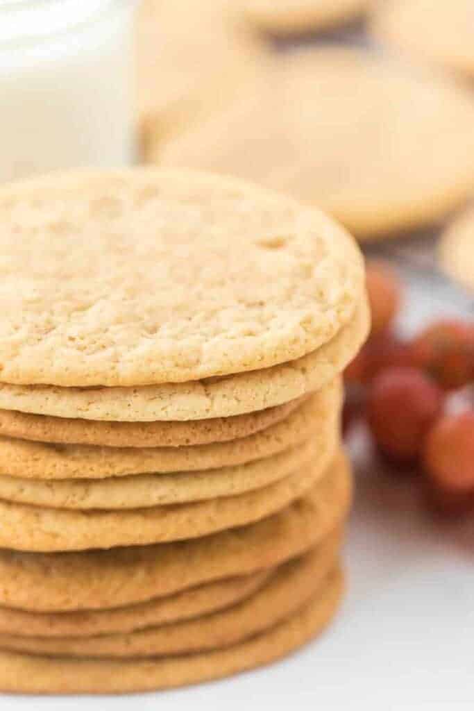 a stack of thin lightly golden cookies