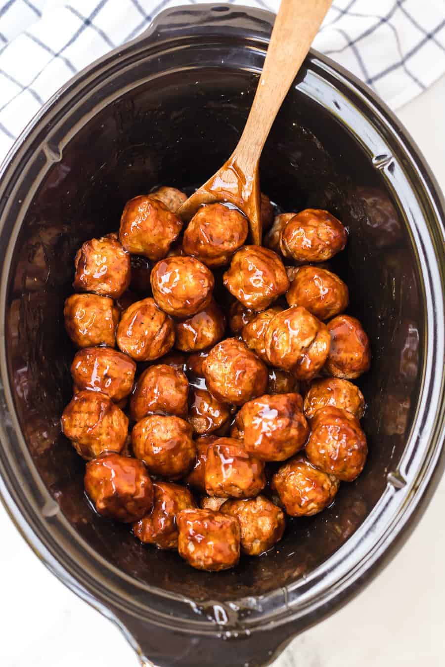 Homemade slow cooker teriyaki honey meatballs are a sweet, savory, and satisfying appetizer that comes together so easily for a scrumptious snack everyone will love. #meatballs #teriyaki #slowcookermeatballs