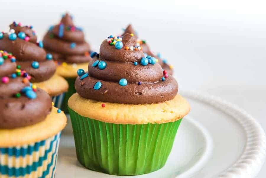 Homemade Chocolate Buttercream Frosting with sprinkles on cupcake