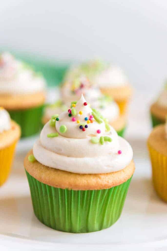vanilla cupcakes with buttercream icing on top