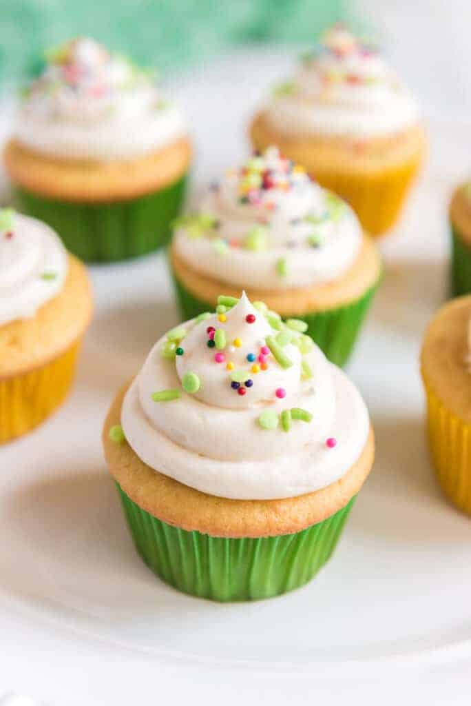 vanilla cupcakes with buttercream icing on top