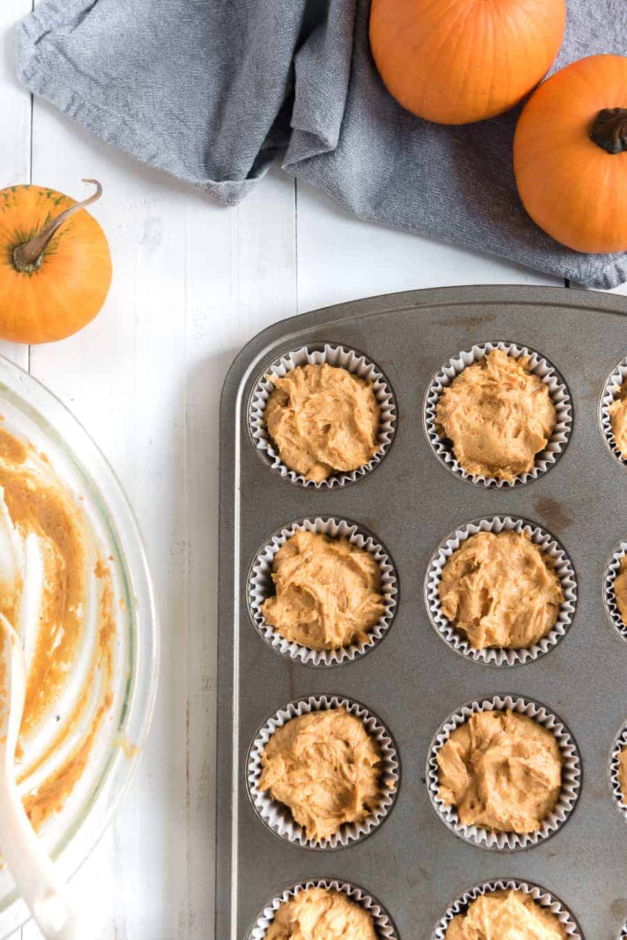 Pumpkin cupcakes with whipped cinnamon icing are perfect bites of fall-inspired sweetness, with just the right amount of pumpkin flavor and warm spices to round them out! #pumpkincupcakes #cupcakerecipe #fallrecipes #pumpkinrecipes #cinnamonfrosting #cupcakes 