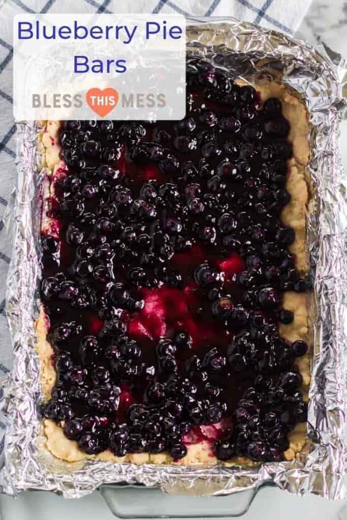 Title Image for Blueberry Pie Bars and a foil-lined rectangular baking dish of blueberry pie bars