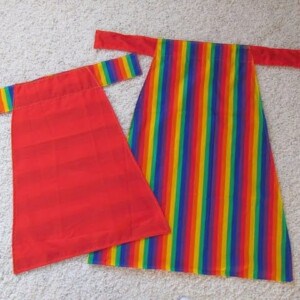 reversible apron - or cape if you're a mom - rainbow on one side and red on the other