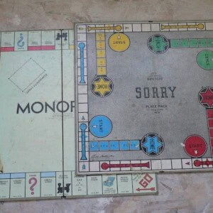 stuff we found in the walls: old monopoly and Sorry board games