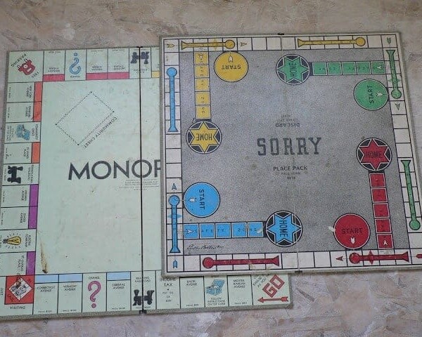 stuff we found in the walls: old monopoly and Sorry board games