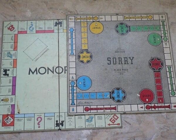 stuff we found in the walls: old monopoly and Sorry board games