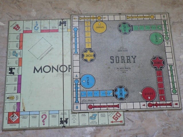 stuff we found in the walls: old monopoly and Sorry board games