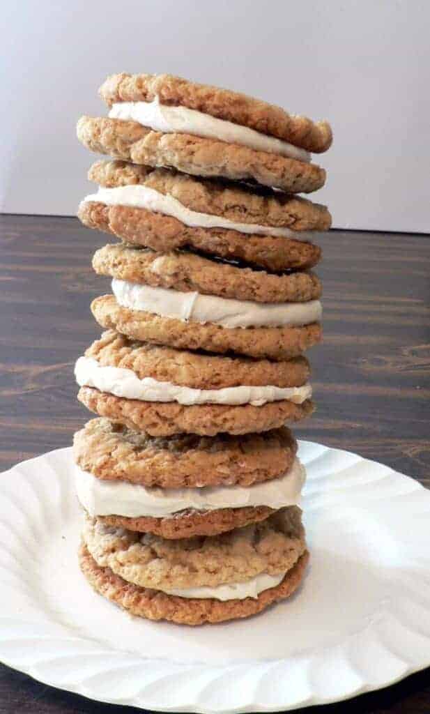 leaning tall stack of oatmeal cream pie cookies on a white plate