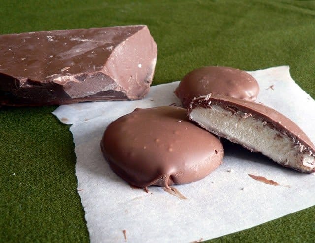 peppermint patties on a napkin with chocolate to the side