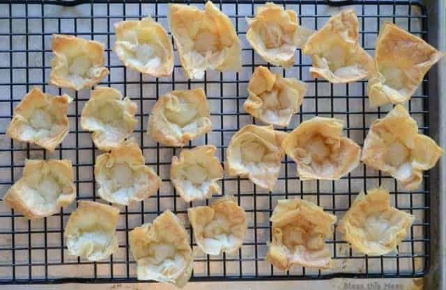 golden mini phyllo cups on a wire cooling rack