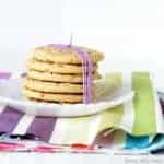 6 perfect peanut butter cookies in a stack and tied with a purple bow