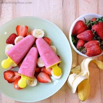 Strawberry Banana Popsicles - made with fruit, yogurt, and milk. Quick, easy, and good for you (and the kids too!)