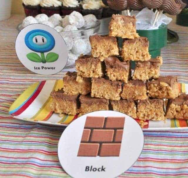 peanut butter bars on a colorful plate with a mario brick label