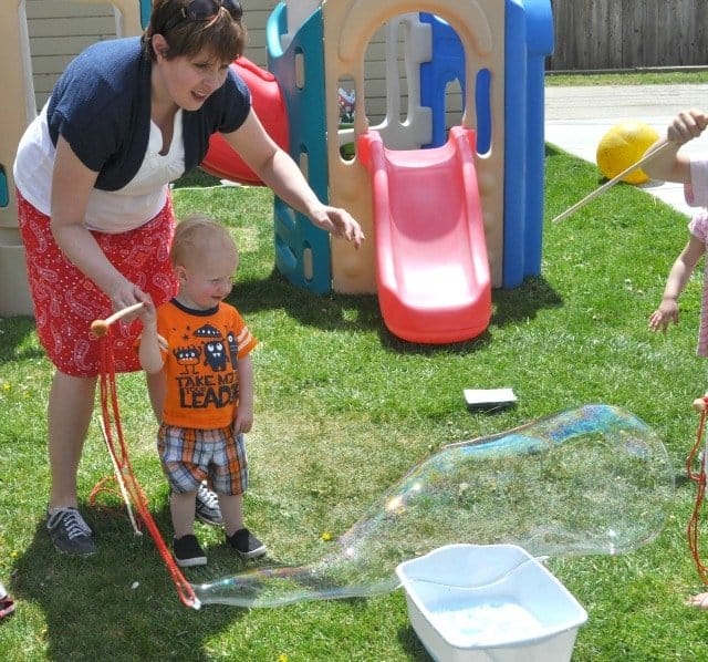 kids blowing giant bubbbles