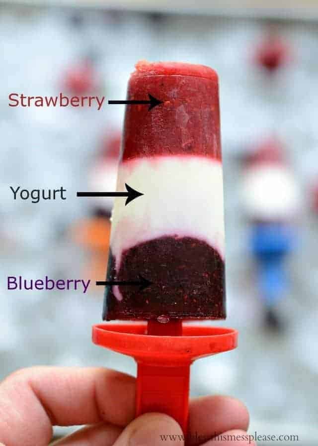 popsicle showing its three colored layers and their flavors