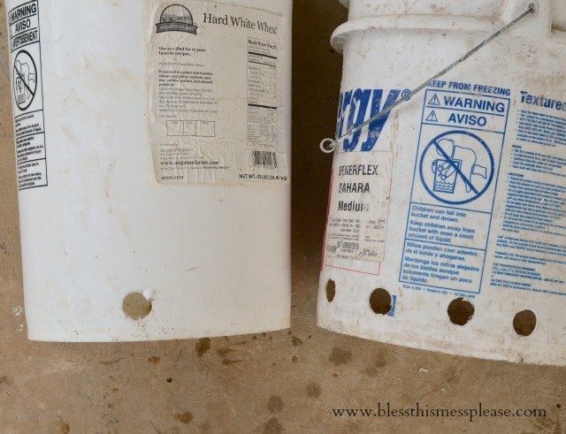DIY chicken water and feeder from 5-gallon buckets from www.blessthismessplease.com white buckets for chicken feeder and waterer.