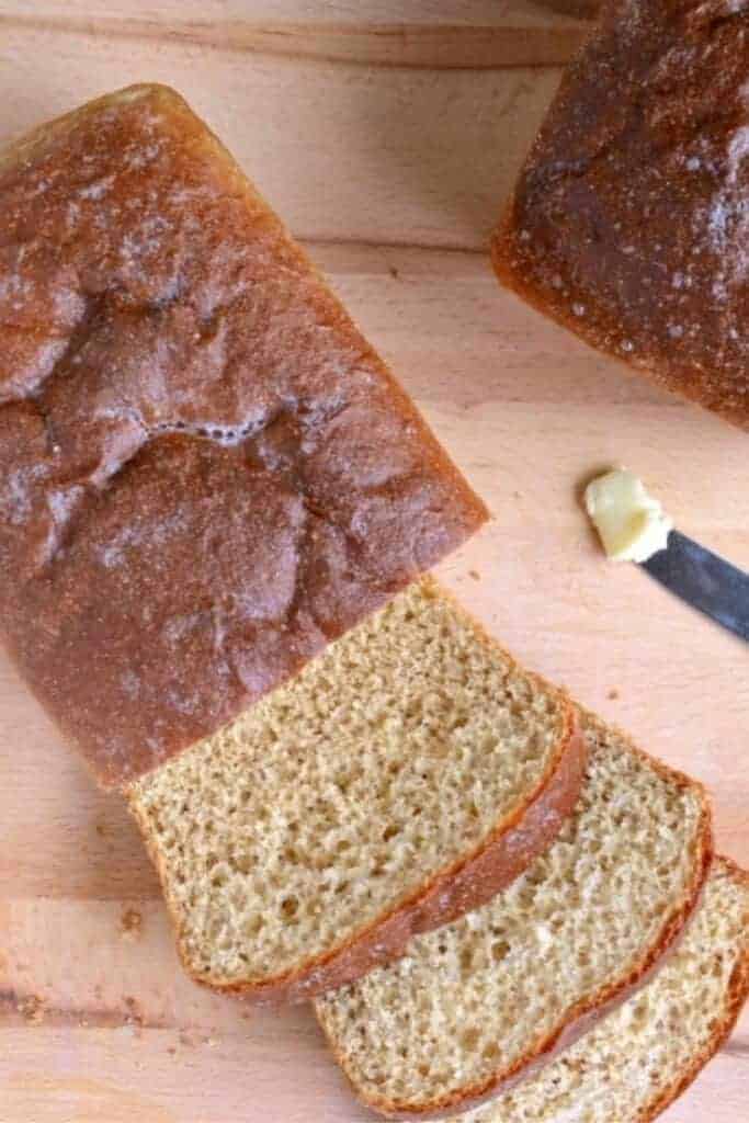 whole wheat bread on wooden cutting board