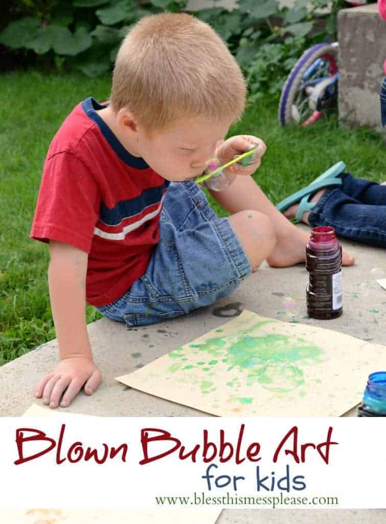 Title Image for Blown Bubble Art for kids with a little boy blowing green bubbles onto a sheet of paper on the sidewalk