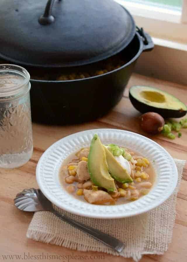 Quick, easy, and healthy white chicken enchilada soup made with chicken, beans and corn on the stove top or slow cooker.