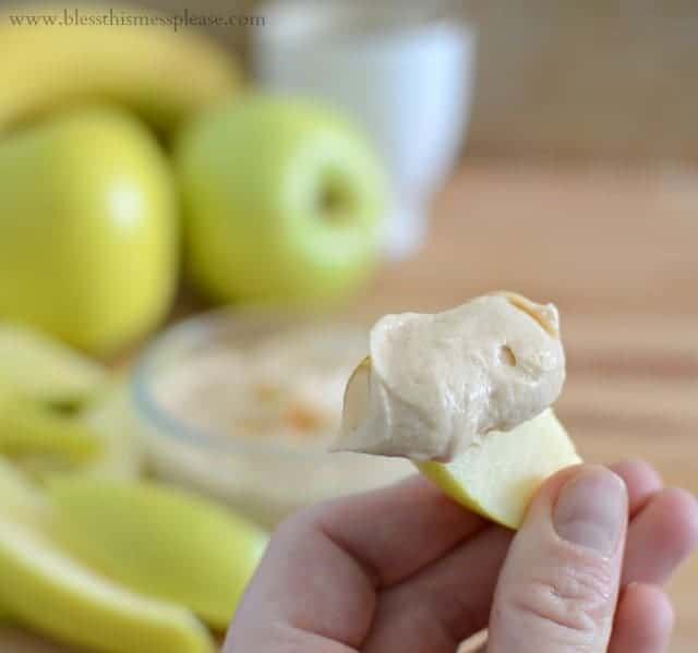 a closeup shot of fruit dip on an apple slice