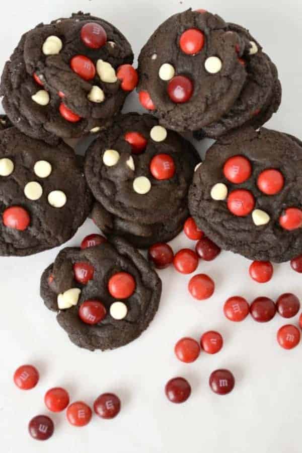 Dark chocolate cookies with red M&M candies and white chocolate chips