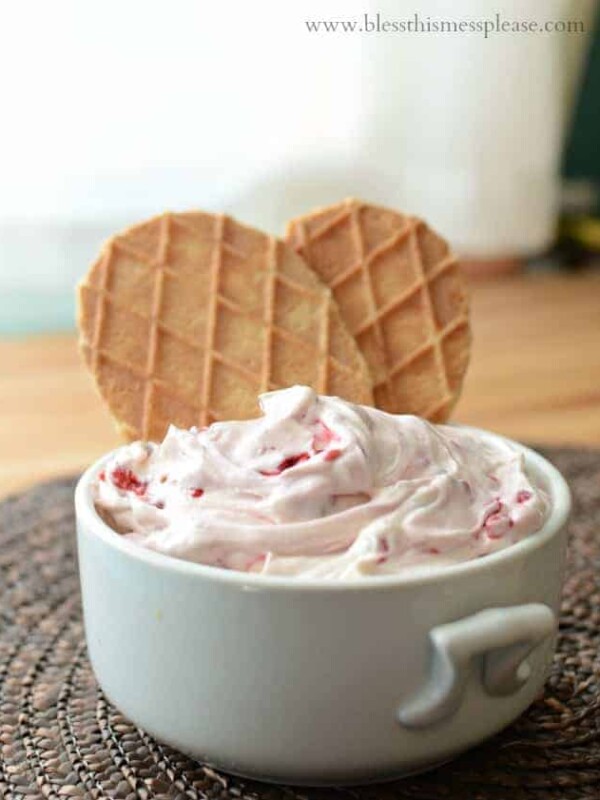 Quick and easy raspberry cheesecake dip. It has five ingredients and takes less than five minutes to whip together. Yes, please!