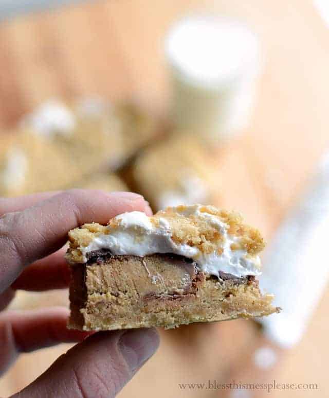 Reese's Stuffed Peanut Butter S'mores Bars | peanut buttery graham cracker infused cookie-like crust, Reese's cups, chocolate, and marshmallow all melted together into one incredible dessert