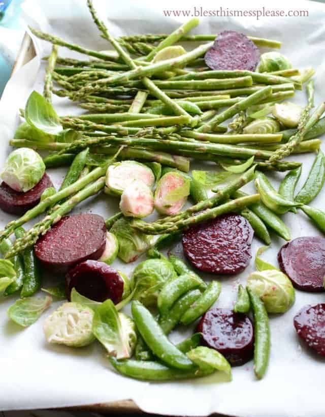 vegetables on parchment paper ready to be roasted