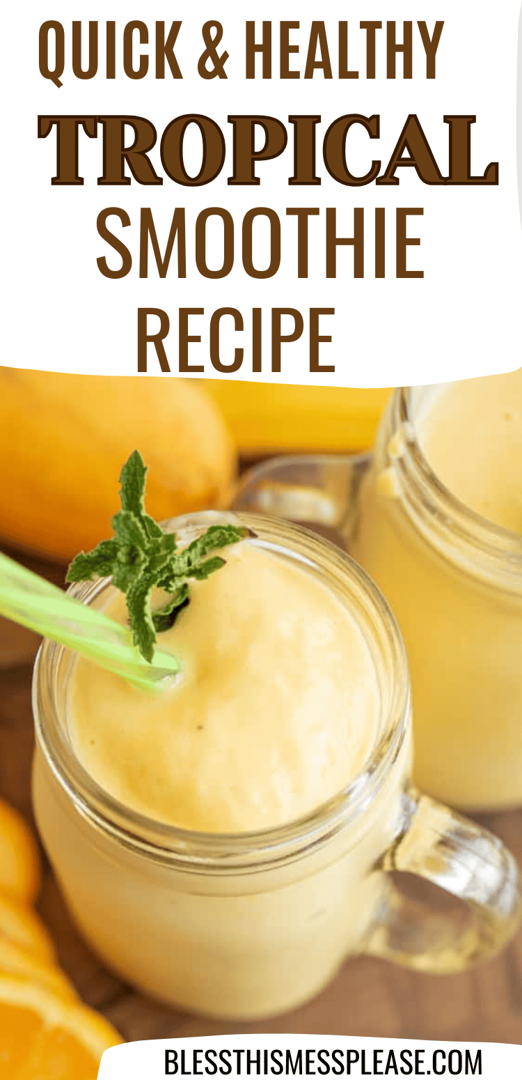 Two clear mason jars filled with creamy yellow drinks from a delicious tropical smoothie recipe, garnished with mint leaves and green straws, sit on a wooden surface. Text above reads: Quick & Healthy Tropical Smoothie Recipe.