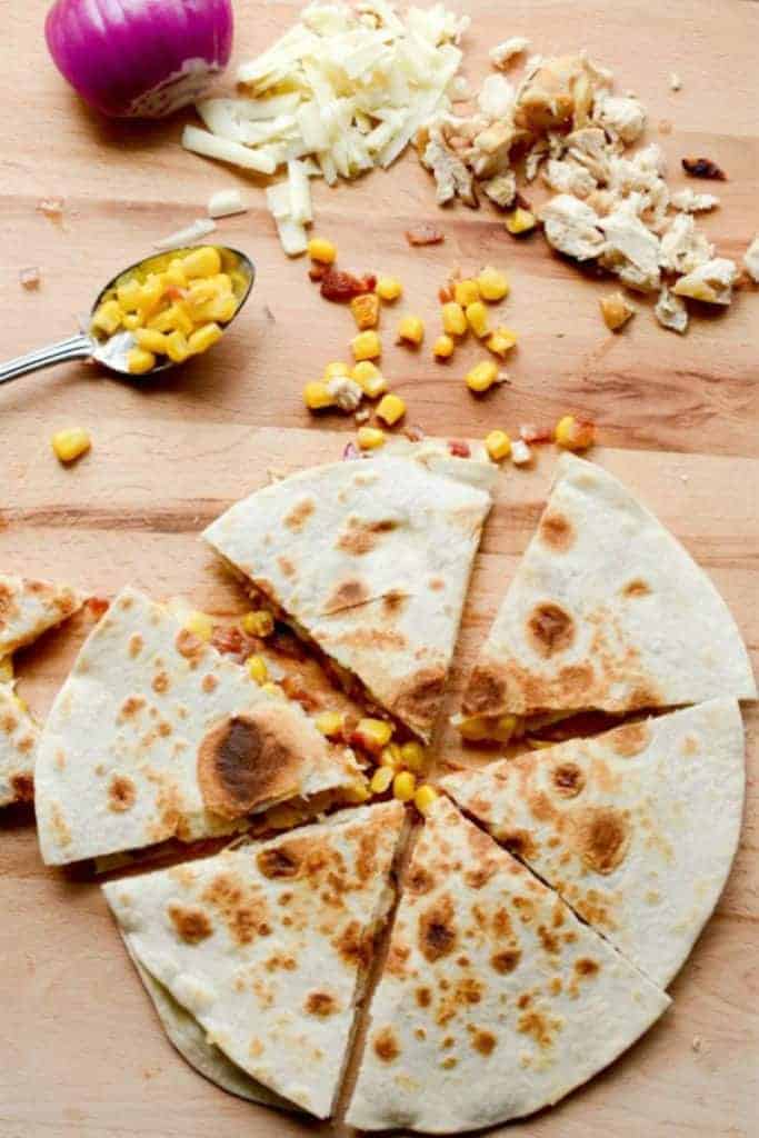 Bacon, Chicken and Sweet Corn Quesadilla with shredded chicken, red onion, shredded cheese and corn