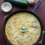 top view garden egg bake in black cast iron skillet