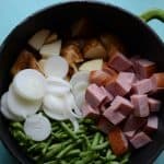 text reads "farmstead one pot wonder" one pot wonder recipe with ham potatoes onion and beans