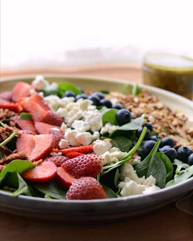 Berry Spinach Salad with Citrus Poppy Seed Dressing on a large plate