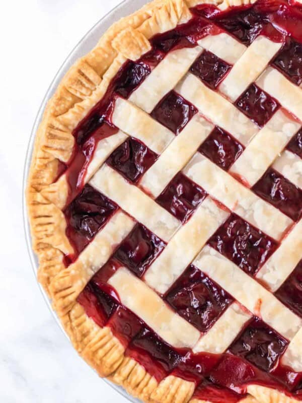 half view of the complete cherry pie with a lattice crust