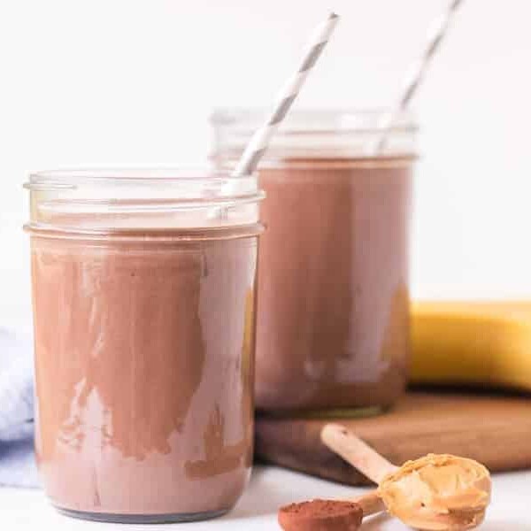 Healthy Chocolate Peanut Butter Smootie in two glasses with paper straws