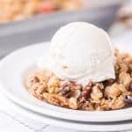 rhubarb crisp with scoop of vanilla ice cream and fork