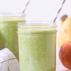 side view of green smoothie in mason jar