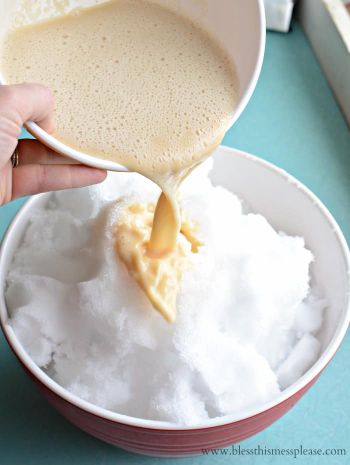 Quick and Easy Snow Ice Cream - 4 ingredients and 5 minutes! Bowl of milk mixture being poured into a big bowl of white snow.