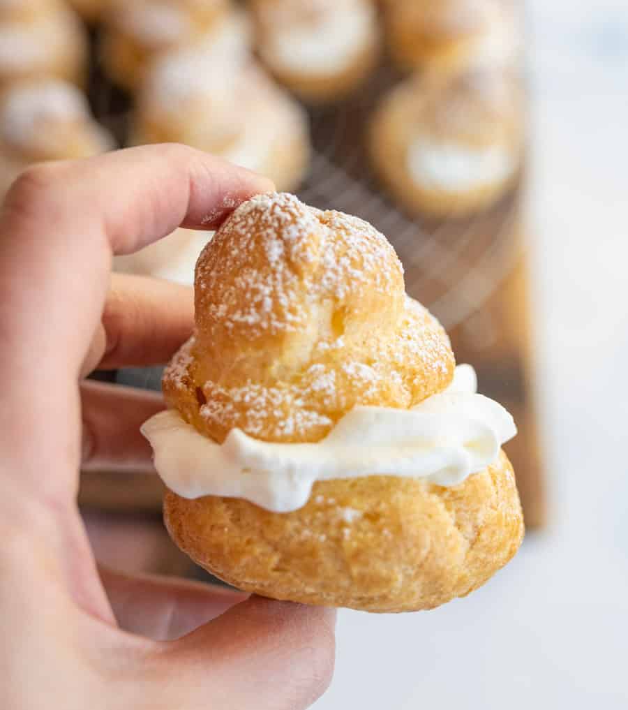 picture of hand holding a cream puff