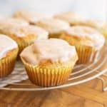 close up picture of lemon poppy seed muffins on a rack