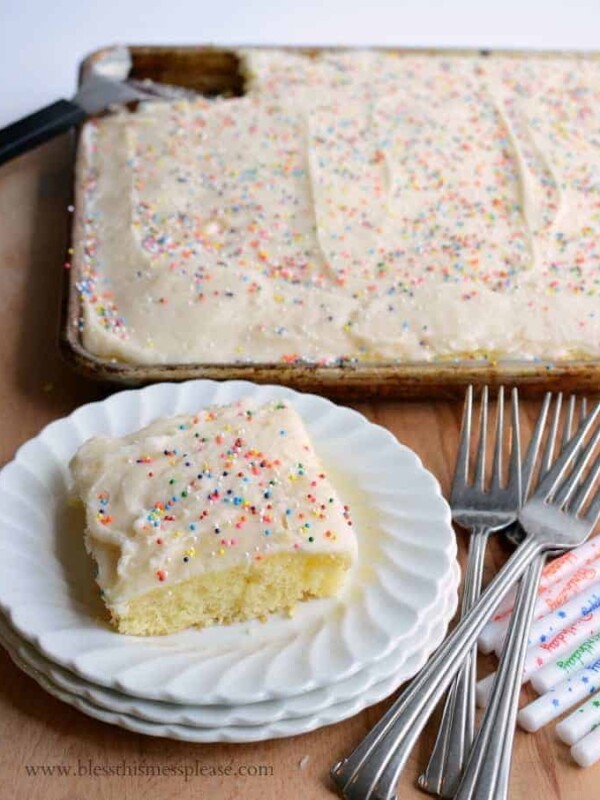 Piece of sheet cake with sprinkles on a plate.