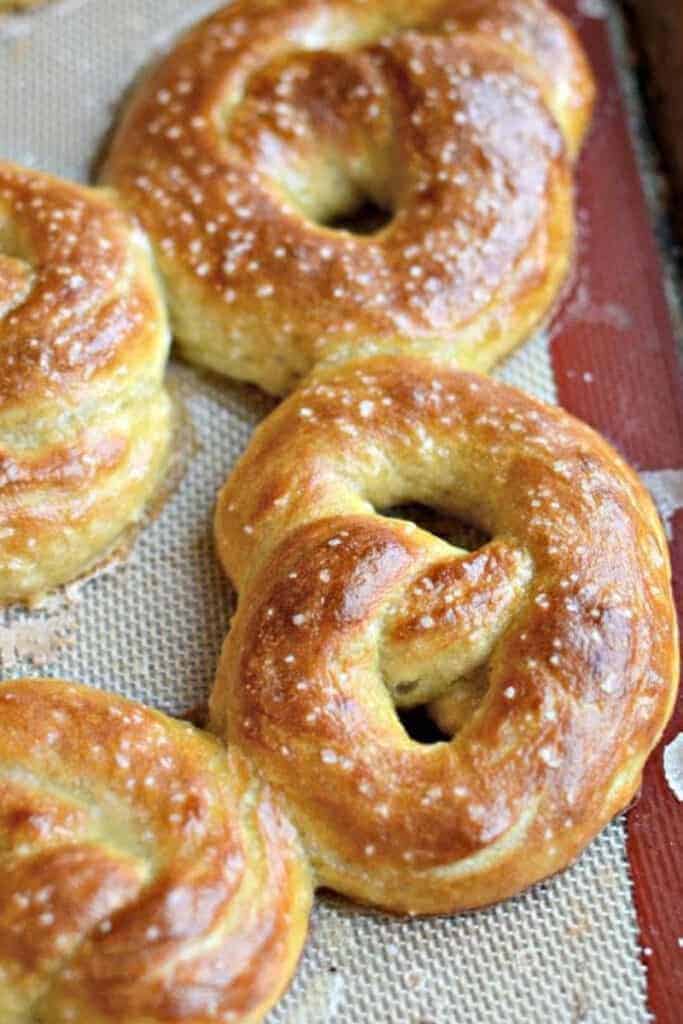hand folded pretzels on a silicone sheet