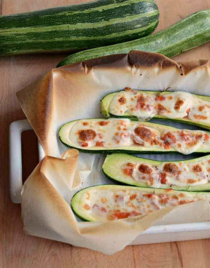 Zucchini boats with tomatoes and fresh mozzarella are a wonderful summer side dish.