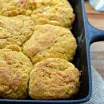 a cast iron skillet with pumpkin biscuits in it