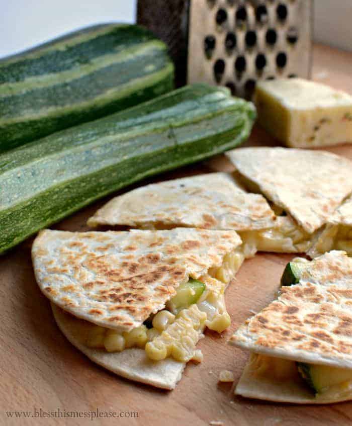quesadilla with corn and chopped zucchini next to whole zucchini.